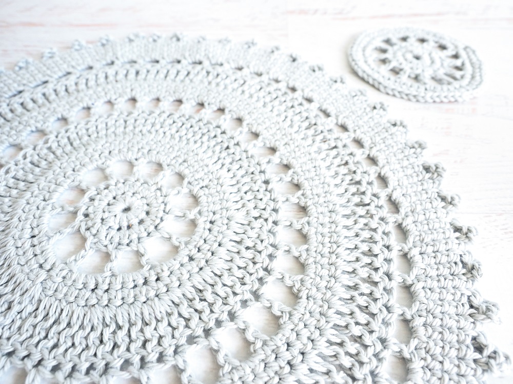 The Table Placement Set includes an intricate crocheted placemat and coaster pattern. These delicate, lacy pieces are the perfect accent to that impressive feast you just prepared. #crochetpattern #crochetplacemat #crochetcoasters #crochetlove #crochetaddict