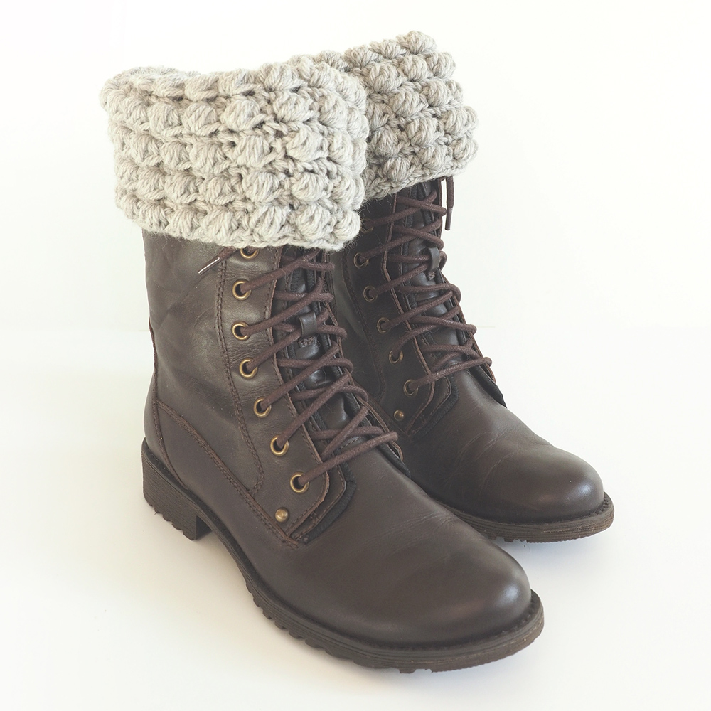 These crochet boot cuffs are really easy to make and are worked in a beautiful silver shade. You can dress up any boots with this simple crochet pattern. #CrochetBootCuffs #CrochetPattern #CrochetAddict 