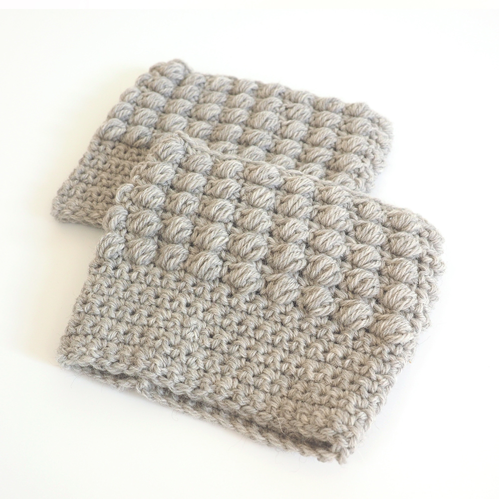 These crochet boot cuffs are really easy to make and are worked in a beautiful silver shade. You can dress up any boots with this simple crochet pattern. #CrochetBootCuffs #CrochetPattern #CrochetAddict 