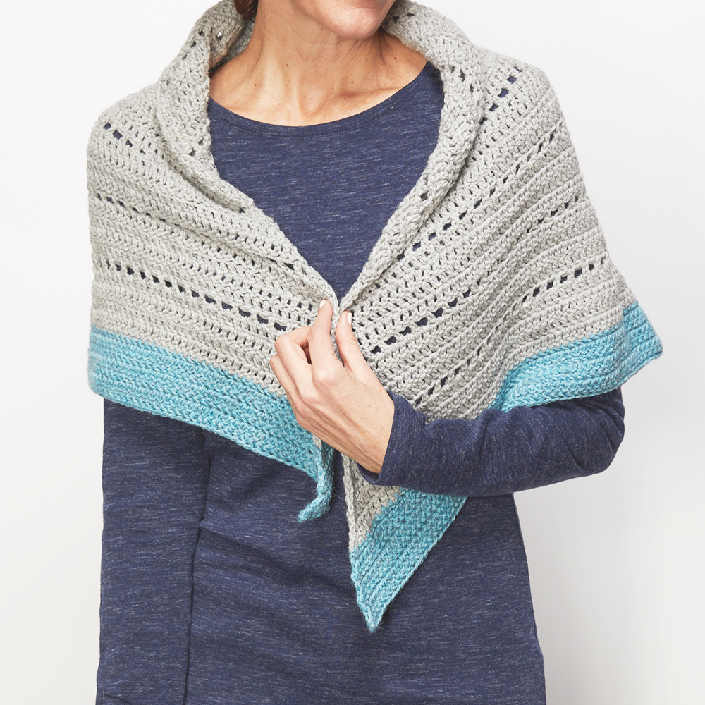 This crochet shawl wrap is the perfect way to keep warm this winter. The free crochet pattern  is so easy to construct and fun too. #CrochetShawl #ShawlCrochetPattern #CrochetPattern #CrochetAddict 