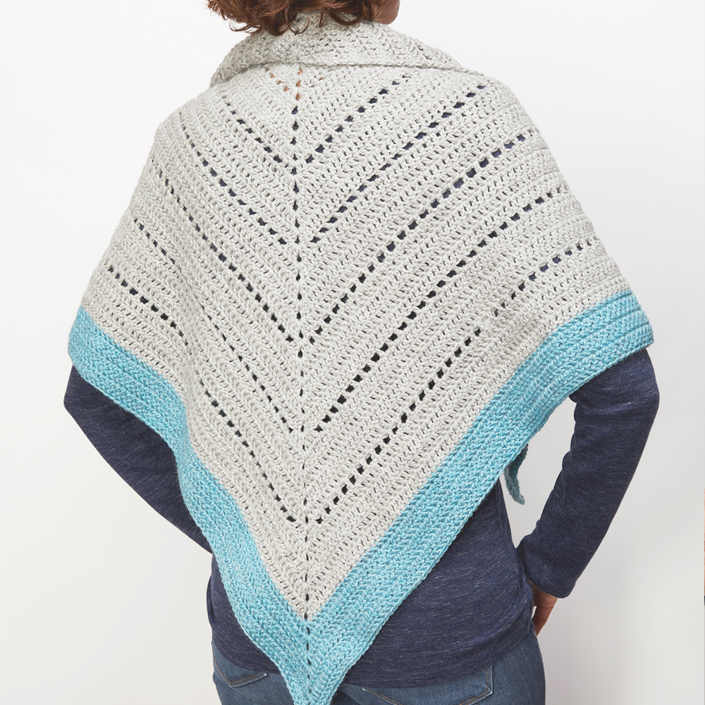 This crochet shawl wrap is the perfect way to keep warm this winter. The free crochet pattern  is so easy to construct and fun too. #CrochetShawl #ShawlCrochetPattern #CrochetPattern #CrochetAddict 