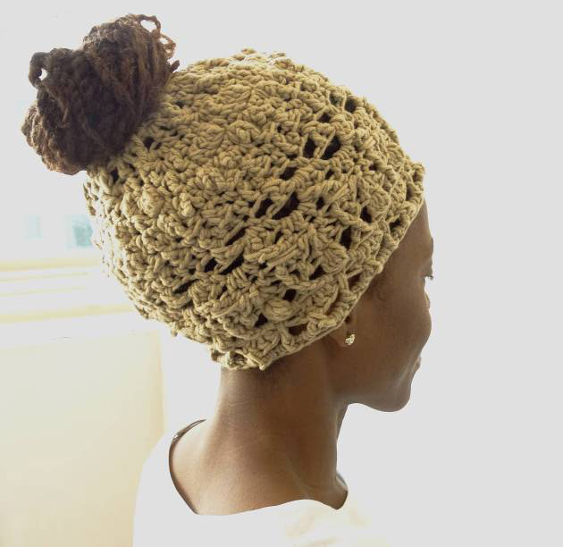 Classic Messy Bun Beanie - These crochet hat patterns are so stylish and fun to make. Each one uses different crochet stitches to create one of a kind designs. #MessyBunHatCrochetPatterns #HatCrochetPatterns #CrochetPatterns