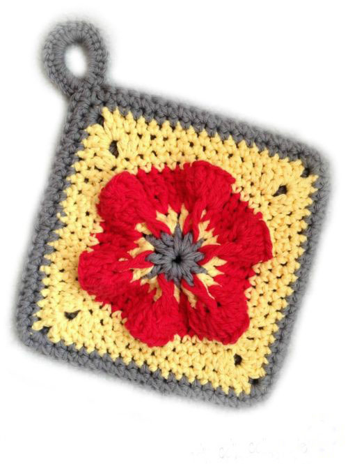Penelope's Pretty Petunia Potholder - These crochet pot holders aren’t challenging to work up and provide a nice lazy day project. Pick out a pot holder pattern and get to work. #CrochetPotHolders #CrochetPatterns #EasyCrochetPatterns