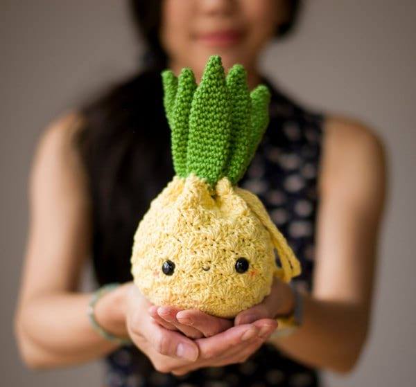 Amigurumi Pineapple Purse - These free crochet purse patterns are full of creative, adventurous ideas. Switch up your look or gift a friend one of these new crochet bags. #CrochetPursePatterns #CrochetPatterns #FreeCrochetPatterns