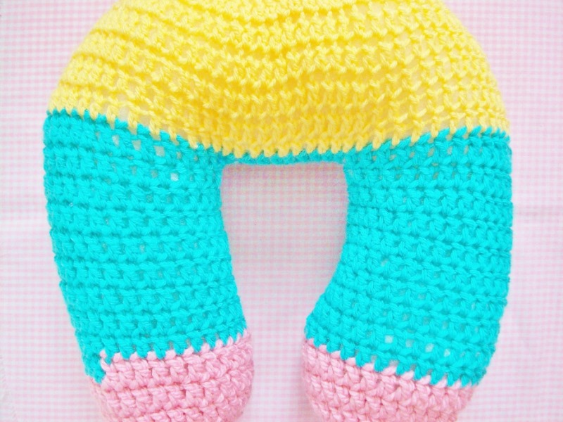 Crocheted Neck Pillow - These are the best pillows and they’re all so beautiful. There are more fun, vibrant designs and more modern crochet pillows on this list. #EasyCrochetPillows #CrochetPillows #CrochetPatterns
