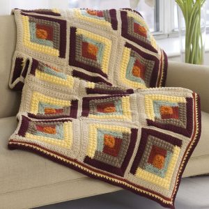 Autumn Log Cabin Throw - We’re celebrating the arrival of Fall by putting together these Fall-inspired free crochet blanket patterns. #freecrochetblanketpatterns #crochetpatterns #fallcrochetblankets