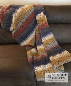 Autumn Shell Blanket - We’re celebrating the arrival of Fall by putting together these Fall-inspired free crochet blanket patterns. #freecrochetblanketpatterns #crochetpatterns #fallcrochetblankets