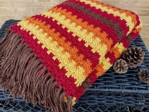 Fall Foliage Afghan - We’re celebrating the arrival of Fall by putting together these Fall-inspired free crochet blanket patterns. #freecrochetblanketpatterns #crochetpatterns #fallcrochetblankets