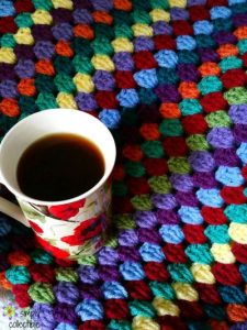 Lily’s Garden Striped Granny Afghan - We’re celebrating the arrival of Fall by putting together these Fall-inspired free crochet blanket patterns. #freecrochetblanketpatterns #crochetpatterns #fallcrochetblankets