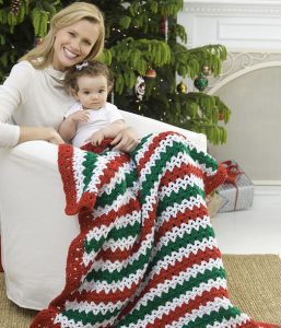 Christmas Striped Throw - This list of free crochet patterns has some fun Christmas decorations that will deck your halls and bring jolly to your days! #crochetpatterns #christmascrochetpatterns #holidaycrochetpatterns