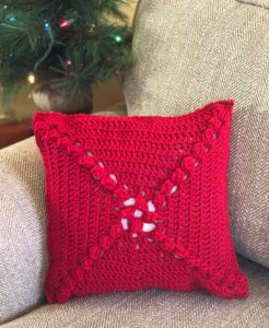 Crochet Christmas Pillow - This list of free crochet patterns has some fun Christmas decorations that will deck your halls and bring jolly to your days! #crochetpatterns #christmascrochetpatterns #holidaycrochetpatterns