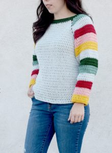 Mod Christmas Sweater - Here are 13 free crochet sweater patterns for the holiday season, including adorable outfits for baby, and out-of-this-world ugly Christmas sweaters! #freecrochetsweaterpatterns #crochetpatterns #crochetsweaters