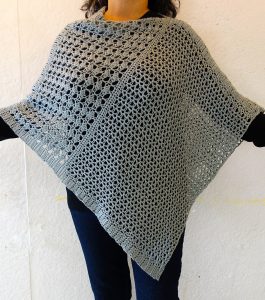 Wrapped Pearl Poncho - These free crochet poncho patterns may be used this winter, but many of the designs here can also work up to spring and even on a cool summer day! #freecrochetponchopatterns #crochetponcho #crochetpatterns
