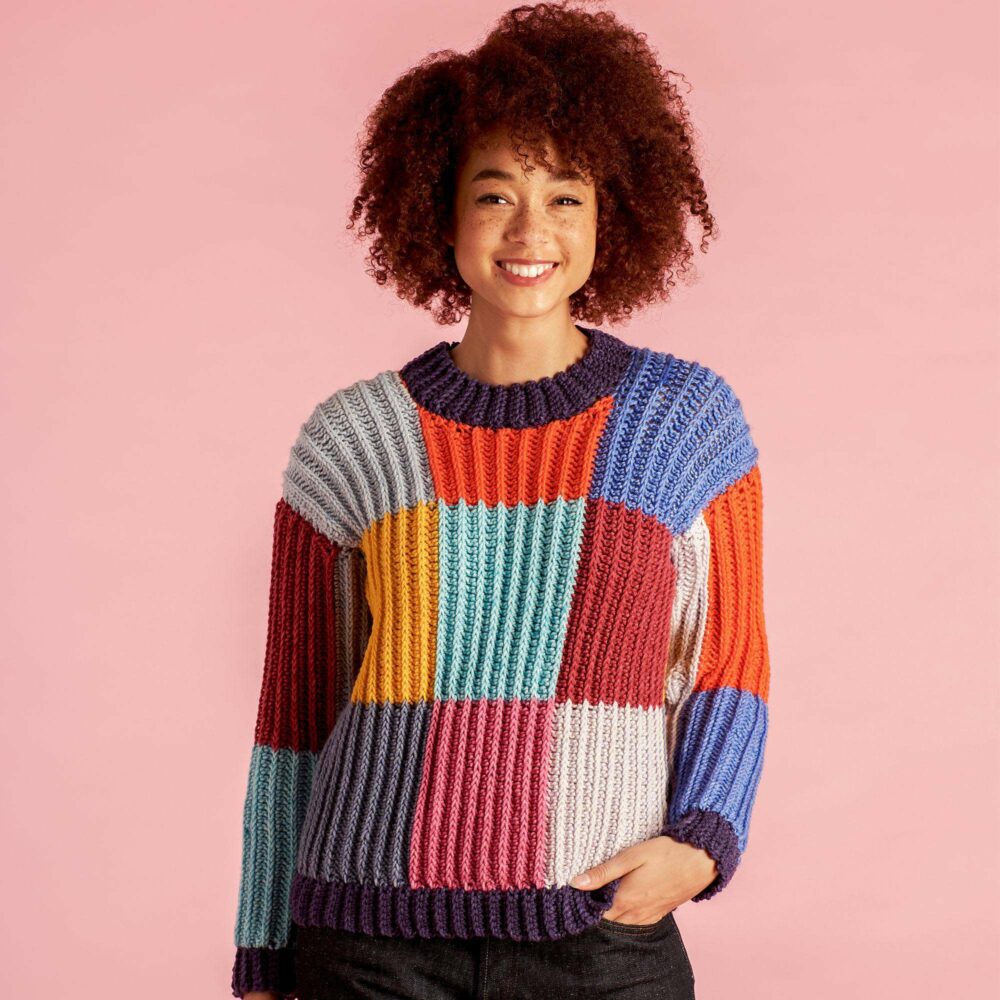 a woman wearing a boxy checks crochet sweater