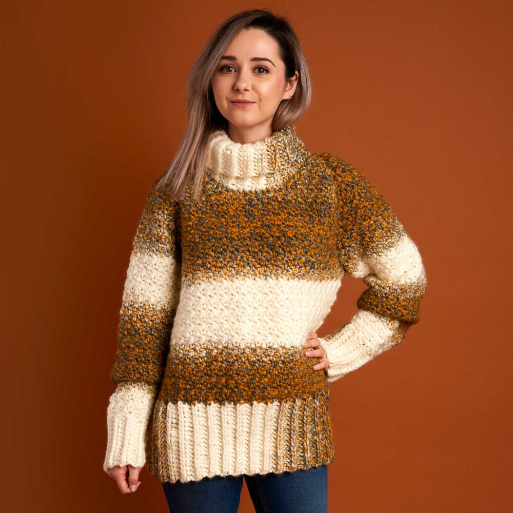 a woman wearing a comfy crochet sweater