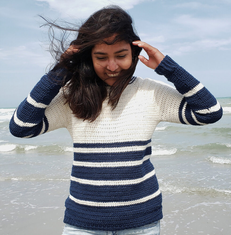 a woman wearing the Nautical Knots Crochet Pullover