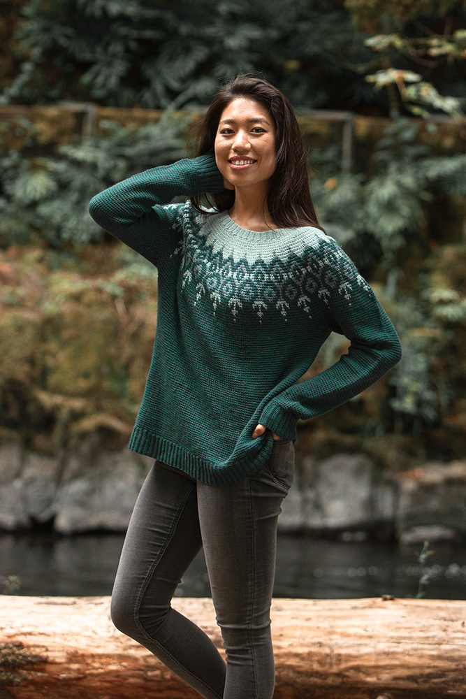 a woman wearing a winter crochet sweater