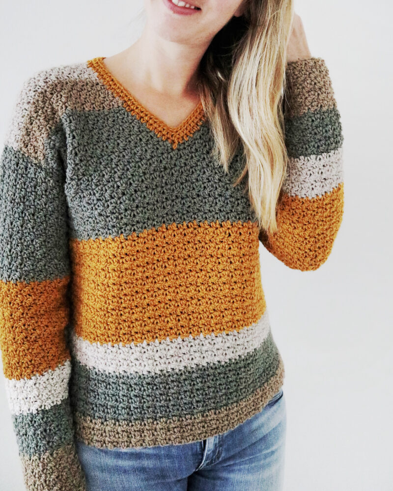 a girl wearing a crochet sweater