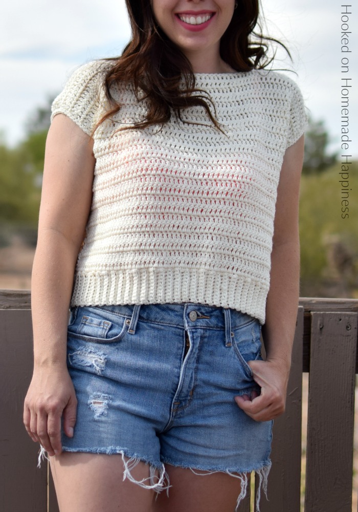 a girl wearing a simple summer crochet tee