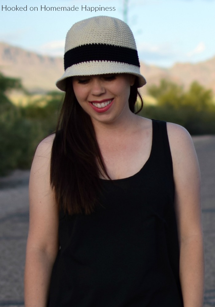 A woman wearing the Beach Day Crochet Bucket Hat 
