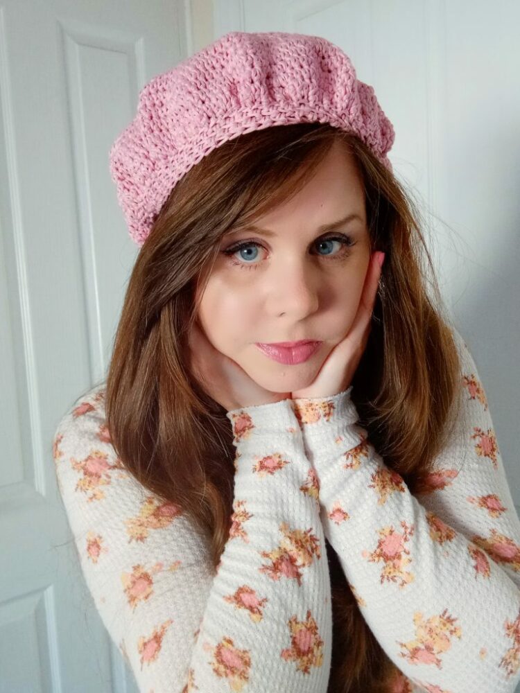 A woman wearing a Crochet Traditional French Beret 