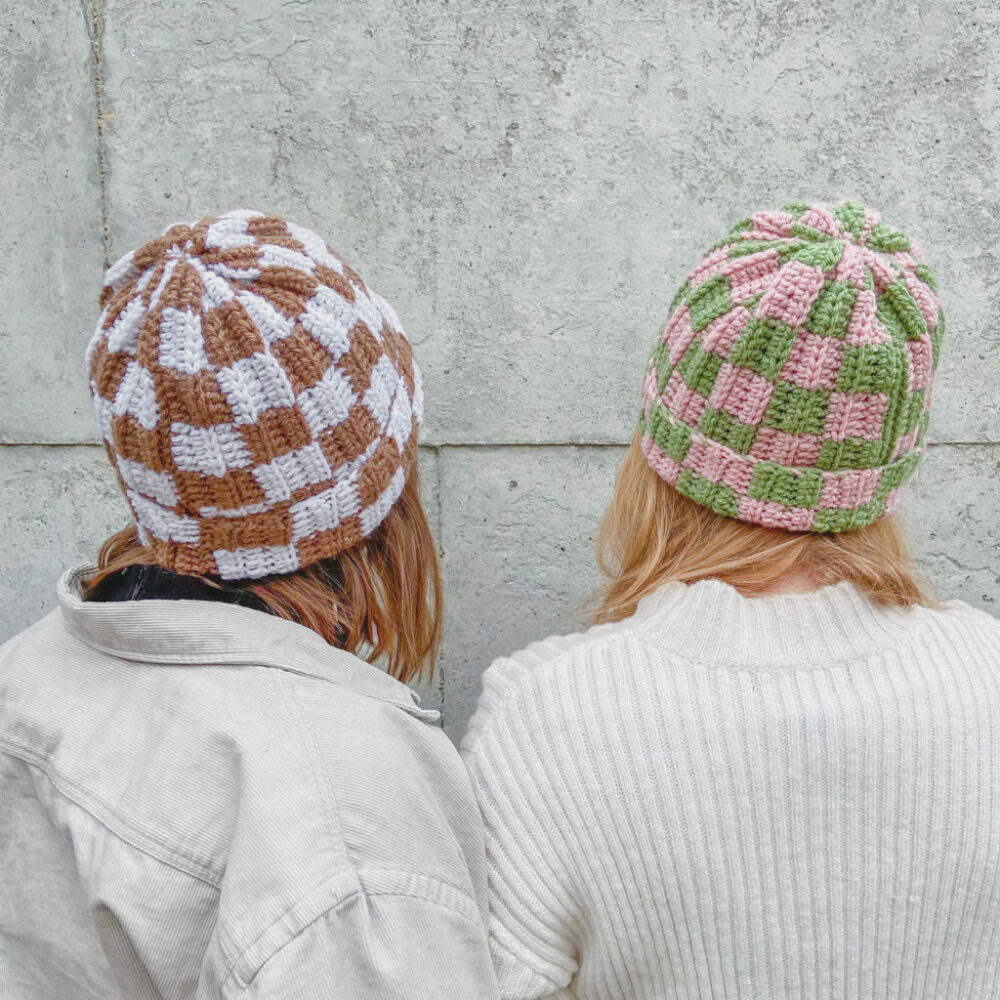 Two girls showcasing their Simple Crochet Ribbed Checker Beanies